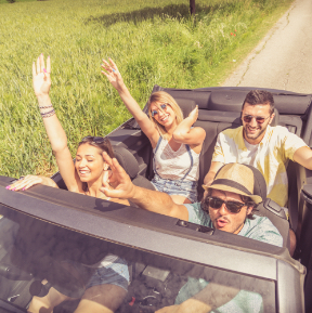 Friends enjoying music in the car